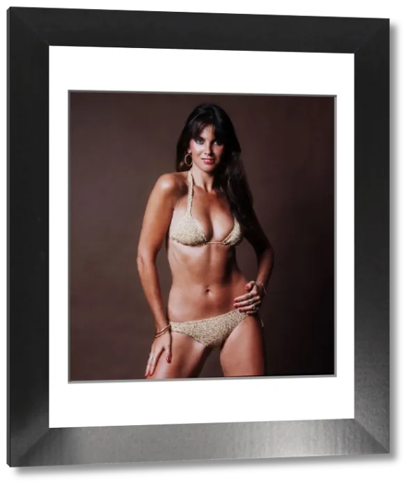 Framed Print : Caroline Munro in Gold Bikini Print 1983 Framed Print : Caroline Munro in Gold Bikini Print 1983
