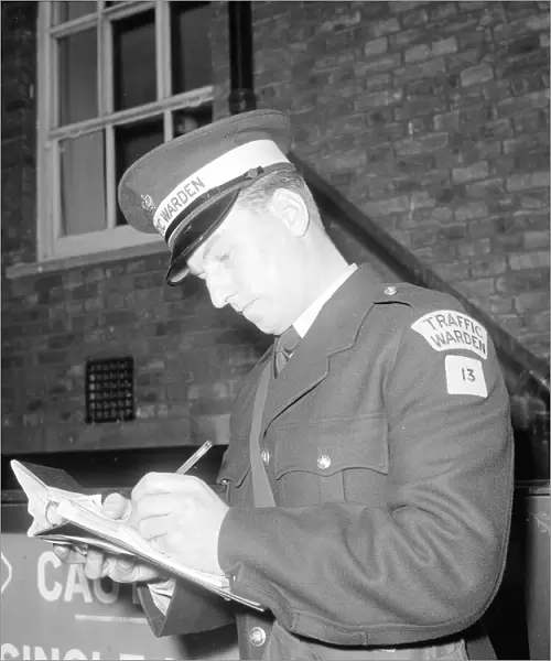 Traffic warden during training writing a fine fining uniform