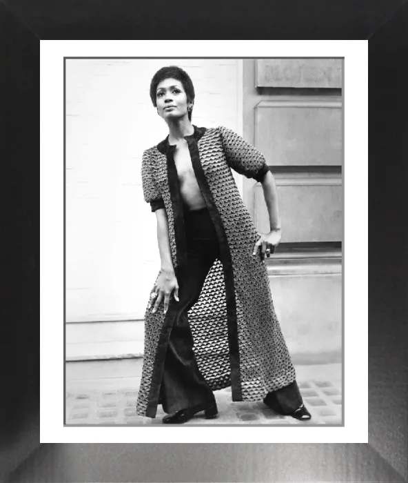 Framed Print : Fashion 1960s Print: A woman models a long coat and matching suede pants Framed Print : Fashion 1960s Print: A woman models a long coat and matching suede pants