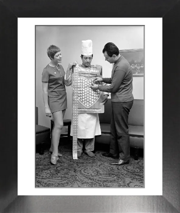 Framed Print : Print of a man in a chef's uniform covered by plastic hearts Framed Print : Print of a man in a chef's uniform covered by plastic hearts