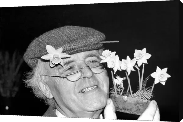 Mr. Allan Warner. Man with flowers. January 1975 75-00531