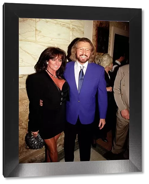 Barry gibb one of the three Bee Gees with wife at the opening night of