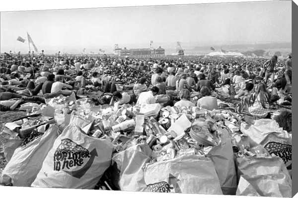 Music fans surrounded by empty cans at The Isle of Wight Festival. 30th August 1970