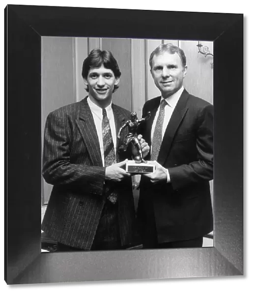 Gary Lineker receives his footballer of the year trophy drom Bobby Moore. 9th May 1986