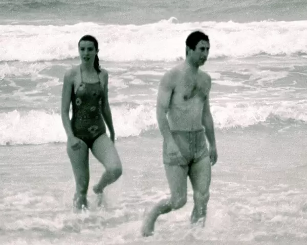 Prince Charles in Australia with unidentified woman. Walking out of the ocean