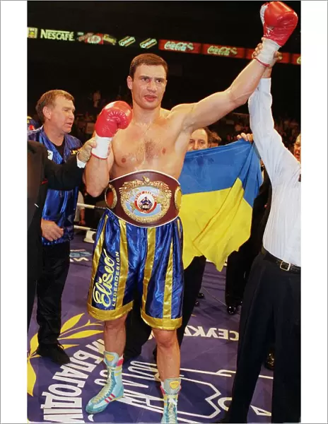 Vitali klitschko with arm in the air after knocking out britians Herbie Hide in two