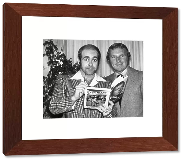 Pop star Elton John also chairman of Watford football club seen here with Bobby Moore at