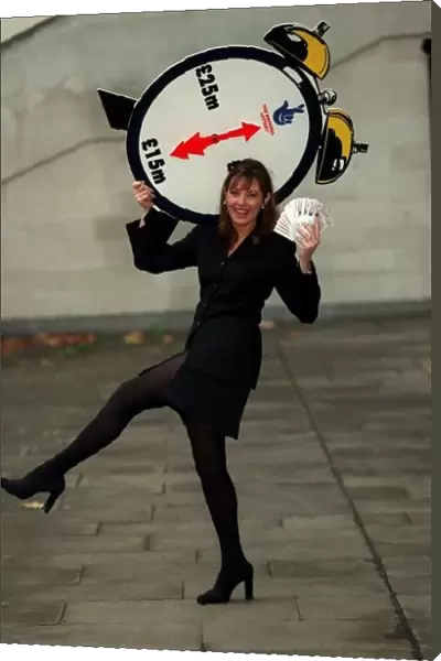 Carol Vorderman TV Presenter November 97 With a lottery clock which shows an arrow