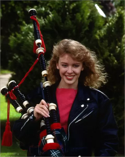 Kylie Minogue holding bagpipes September 1988