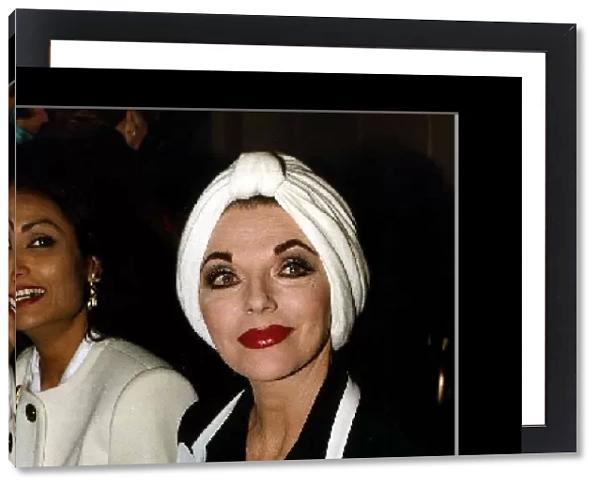 Joan Collins Actress and Shakira Caine sit side by side at a fashion show in London