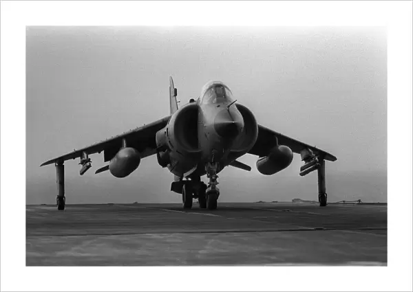 A Fleet Air Arm Sea Harrier prepares to take off from the flight deck of HMS Invincible