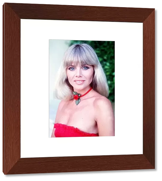 Actress Britt Ekland wearing rose necklace July 1977