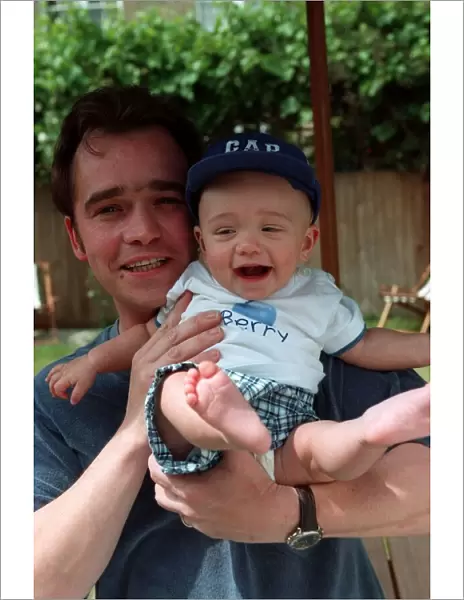 Actor Todd Carty with baby son James at home June 1997