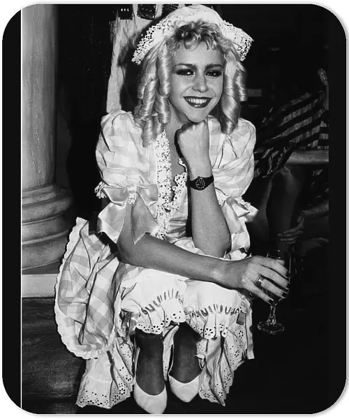 Leslie Ash Actress dressed in costume of nursery rhyme character Little Miss Muffet takes
