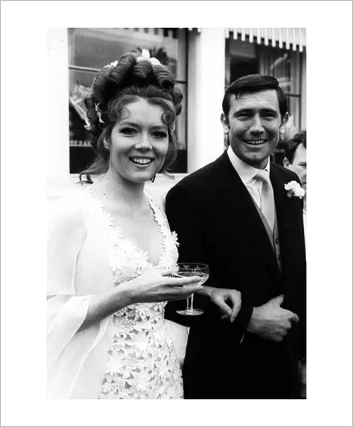 Actress Diana Rigg with George Lazenby getting married during the filming of '