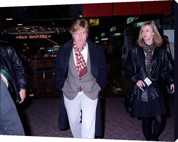 Robert Redford actor at London airport with unidentified womam
