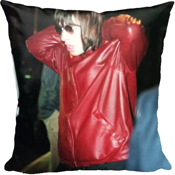 Liam Gallagher of Oasis at the Edinburgh Festival wearing a red leather jacket