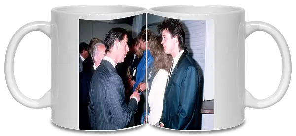 Singer Paul Young with Prince Charles at a concert to celebrate the 10th anniversary of
