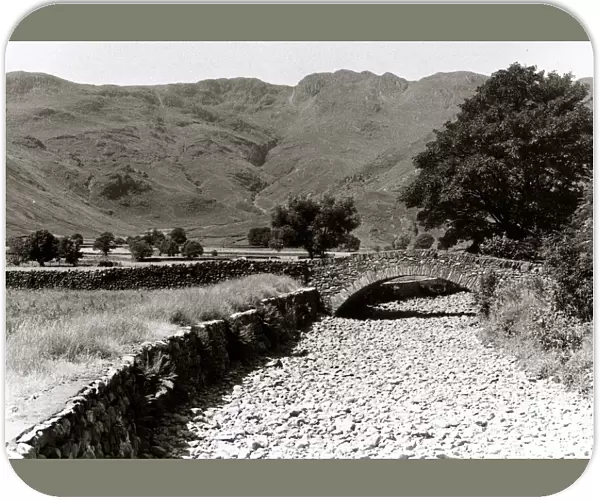 Great Langdale Beck runs empty during the long drought in the summer of 1976 in the Lake