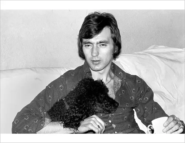 England and Stoke international hero Alan Hudson seen here with his pet poodle