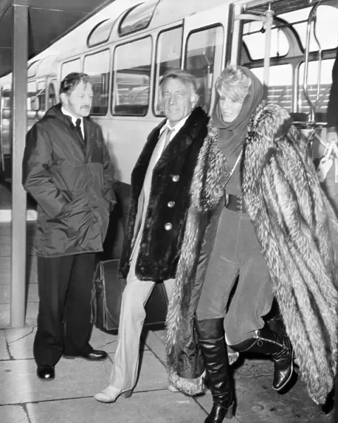 Richard Burton and his wife Susie Hunt pictured arriving at Heathrow airport today
