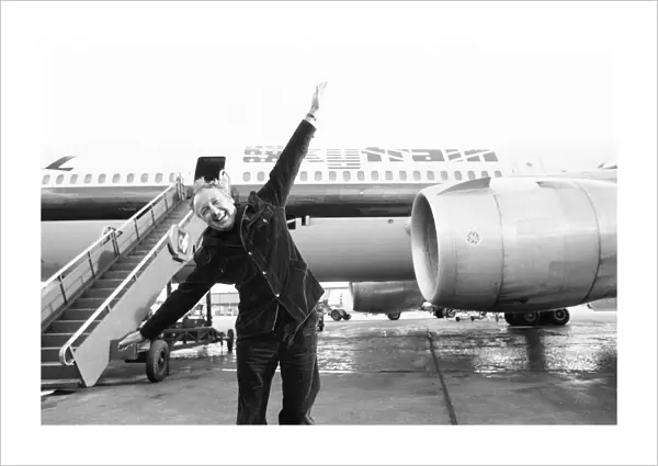 Head of Laker Airways Freddie Laker in jubilant mood on the runway at Gatwick airport