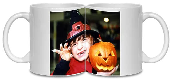 Halloween - little witch Bethan Parker (aged 6) of Rhydyfelin with her Halloween pumpkin
