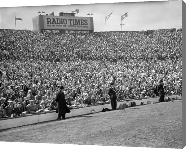 Crowds scenes during match action from the 1959 FA Cup Final at Wembley Stadium