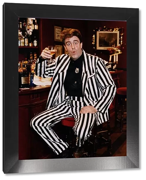 Iain McColl actor white black striped suit bar drink whisky