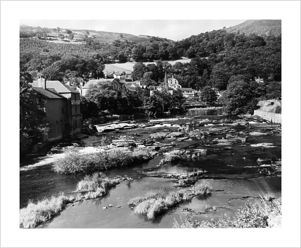 General view showing the River Dee as it meanders through the hill girdled town of