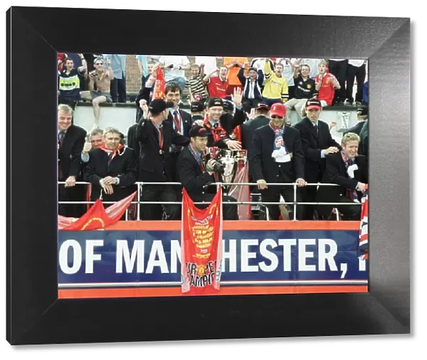Manchester United Homecoming on open-top bus May 1999 is mobbed by fans at