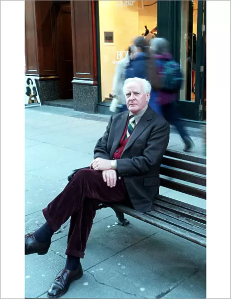 David Cornwall Author March 1999 Sitting on bench in Buchanan Street Glasgow Legs
