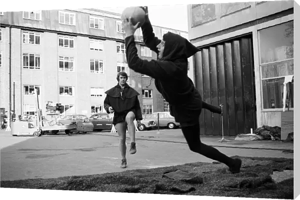 John Jackson leaps for the ball, kicked by Geoff Hurst at Thames TV Studios at Teddington