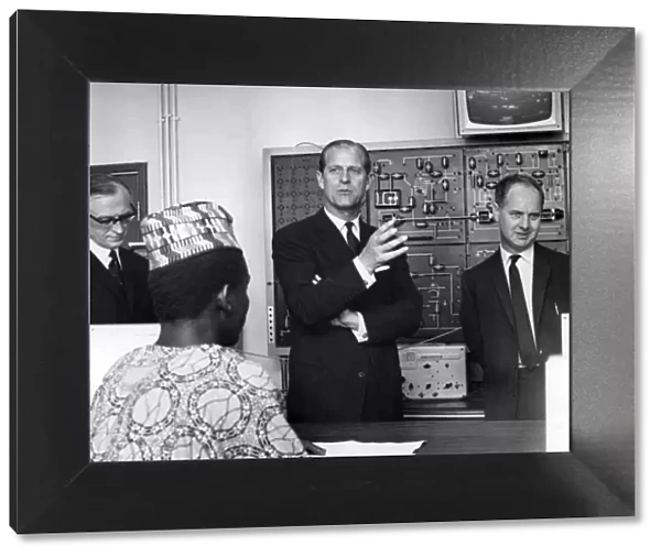 Prince Philip, Duke of Edinburgh talks to some of the students in the Radio laboratory at