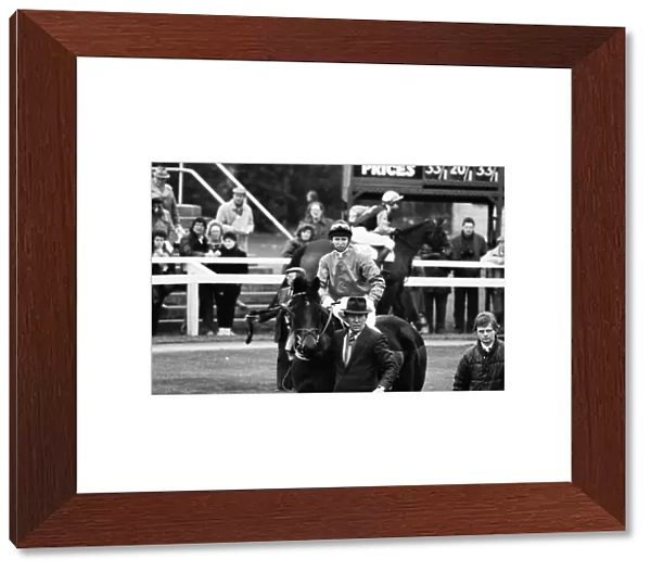 Princess Anne races at Newbury Racecourse, Berkshire. She is pictured alongside her