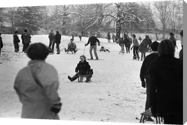 General views of tobogganing and skiing in Richmond Park, London. 27th December 1970