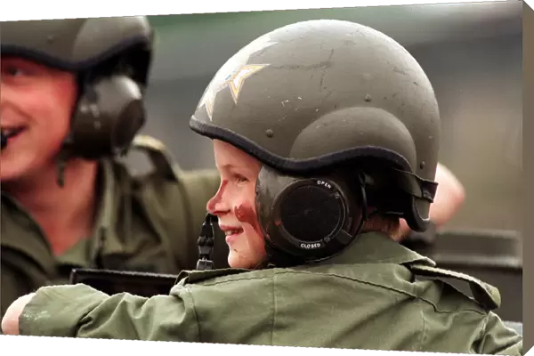 PRINCE HARRY IN UNIFORM IN A TANK VISITING THE LIGHT DRAGOON BARRACKS IN GERMANY