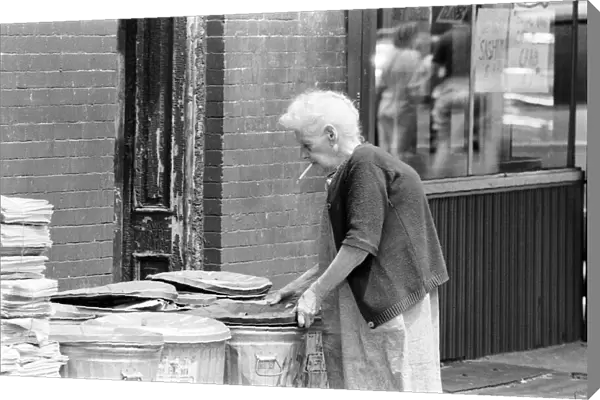 Elderly Woman putting out the trash, New York, USA, June 1984