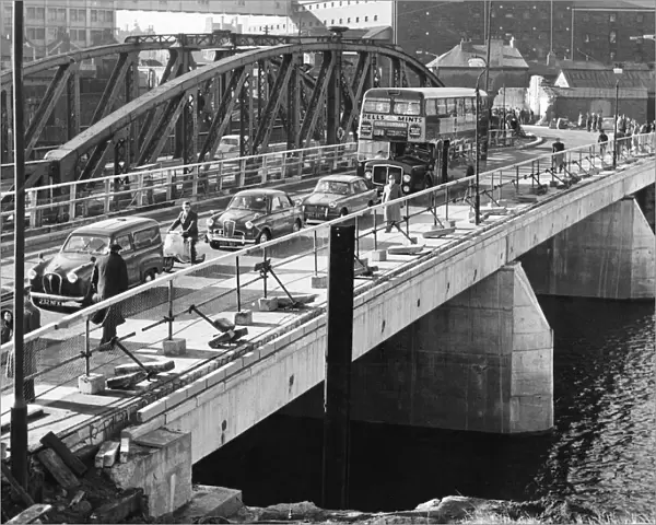 The first traffic moves across the new bridge over the River Tawe at Swansea on Monday