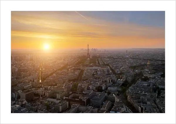 Aerial view of Paris skyline with Eiffel Tower at sunset in Paris, France