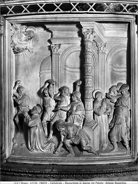 The stoning of St. Stephen: Bas-relief of a panel of the marble pulpit by Mino da Fiesole and Antonio Rossellino. Located in the Cathedral of Prato