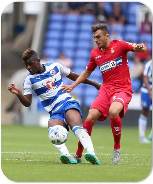 Reading FC: Aaron Tshibola Fights for Possession Against Espanyol