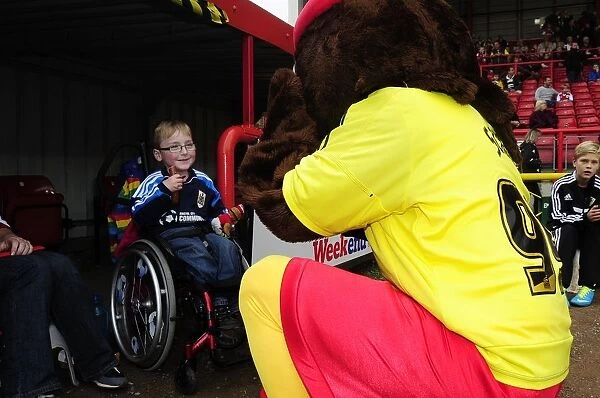 Bristol City Mascot Greets Young Fan at Ashton Gate during Bristol City vs Colchester United (Sky Bet League One)