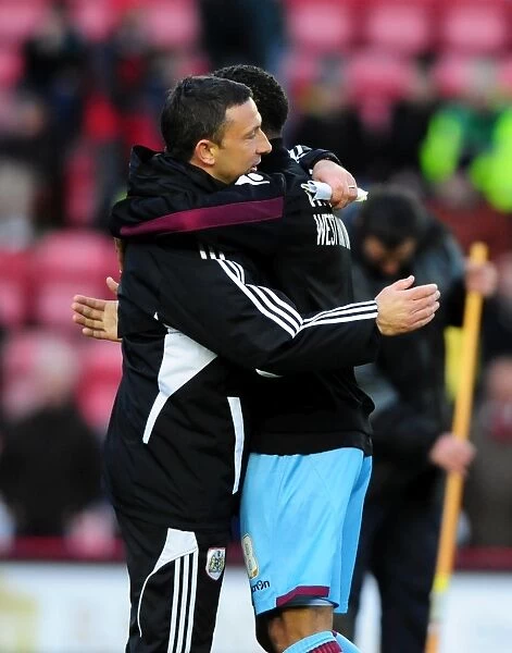 Bristol City's Derek McInnes and Nicky Maynard of West Ham United Embrace Post-Match at Ashton Gate Stadium