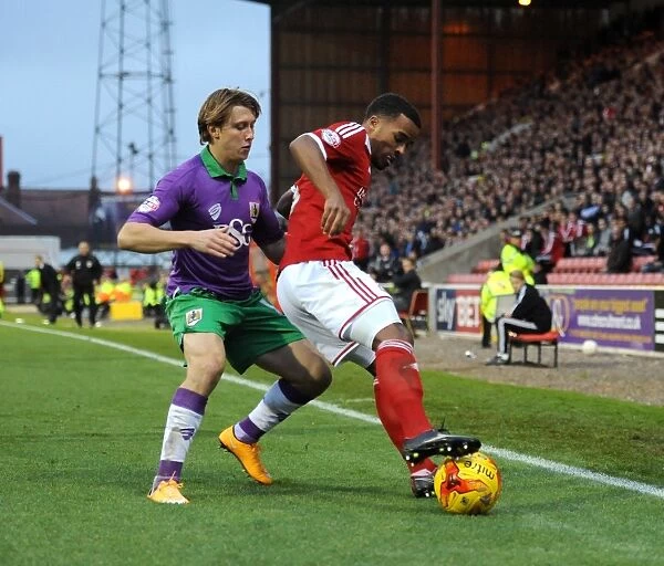 Bristol City's Luke Freeman Chases Down Swindon Town's Nathan Byrne in Sky Bet League One Clash