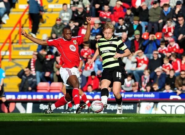 Intense Rivalry: Cisse vs. Wright in the Championship Clash between Bristol City and Scunthorpe United (February 2010)