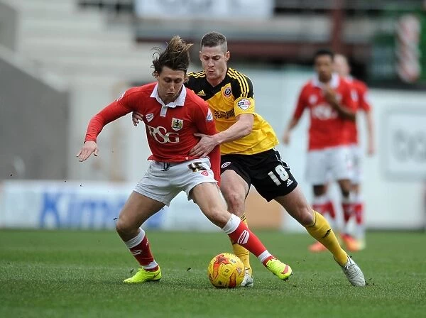 Intense Rivalry: Paul Coutts Fouls Luke Freeman in Bristol City vs. Sheffield United Clash, Sky Bet League One