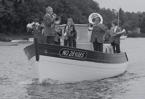 Band Afloat. Brass Band Musicians on a boat on The Nantes Brest Canal waterway France Date