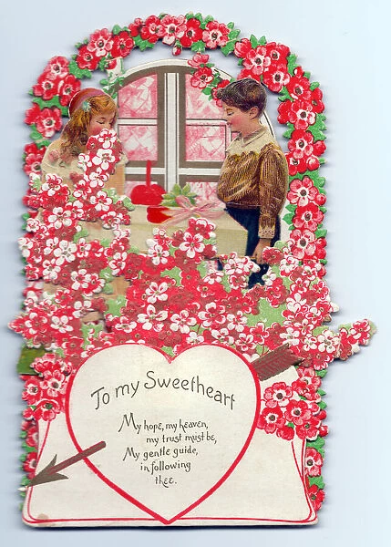Boy and girl with flowers and verse on a Valentine card