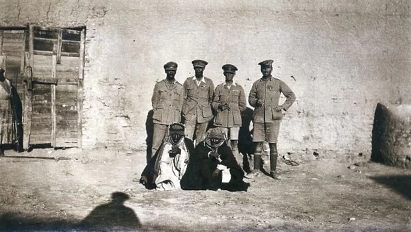 British officers and arabs outside a building, Middle East